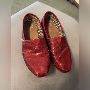 Ruby red sparkling slip on flats.